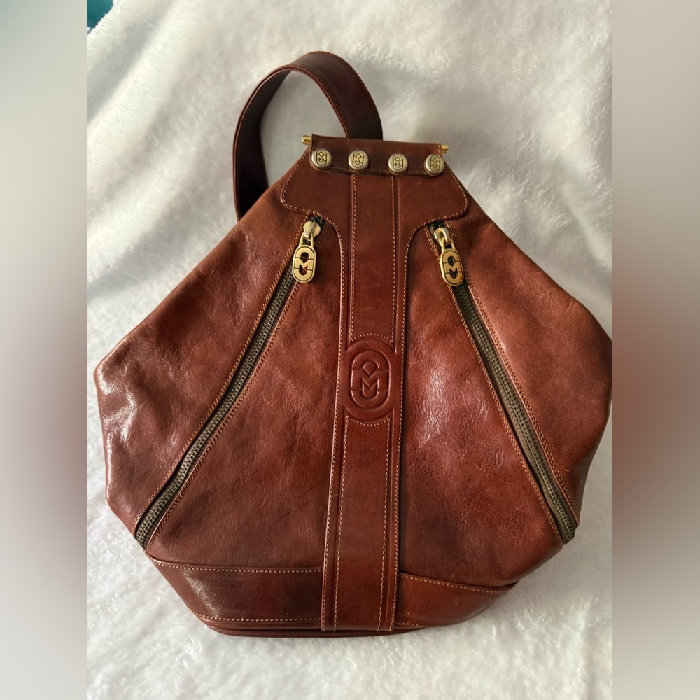 Marino Orlandi Embossed Leather Logo Sling Backpack Convertible Handbag